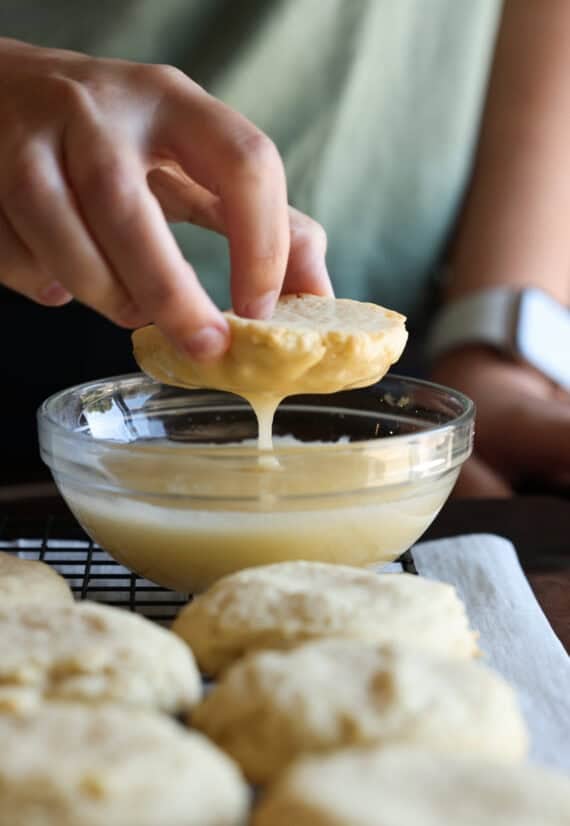 Dipping the top of a Kentucky Butter cookie in icing.