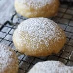A butter cookie coated in glaze and dusted with powdered sugar.