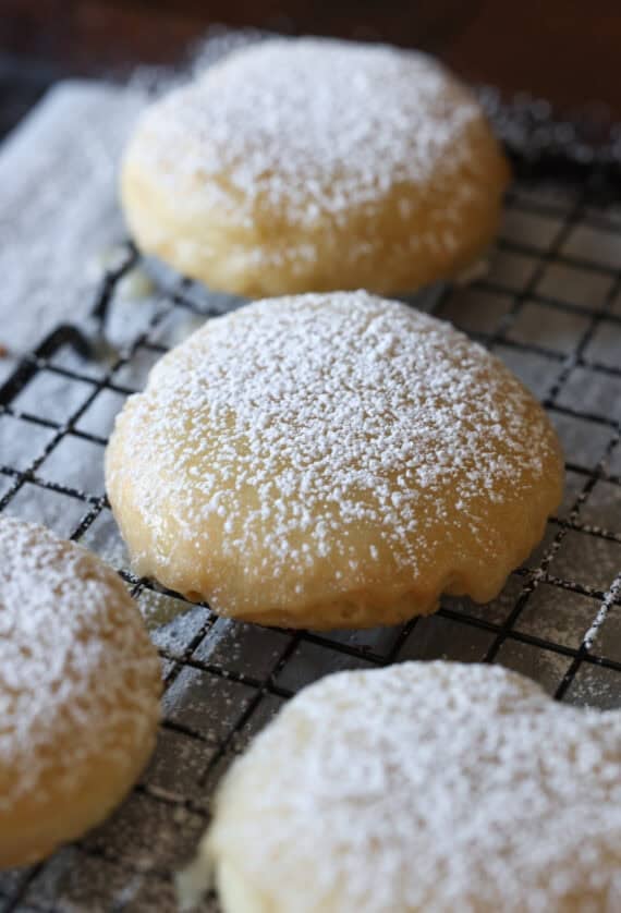 A butter cookie coated in glaze and dusted with powdered sugar.