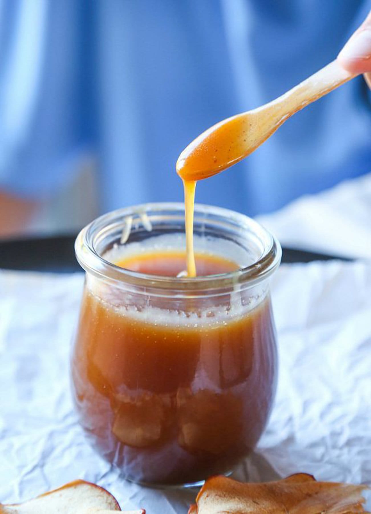 Apple cider caramel glaze drizzled into a cup