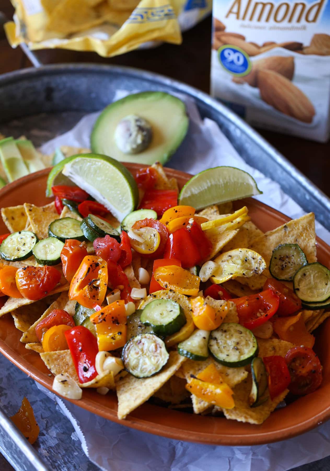 Roasted veggie nachos served on a platter