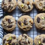 Chocolate chunk pistachio cookies on a wire rack from above