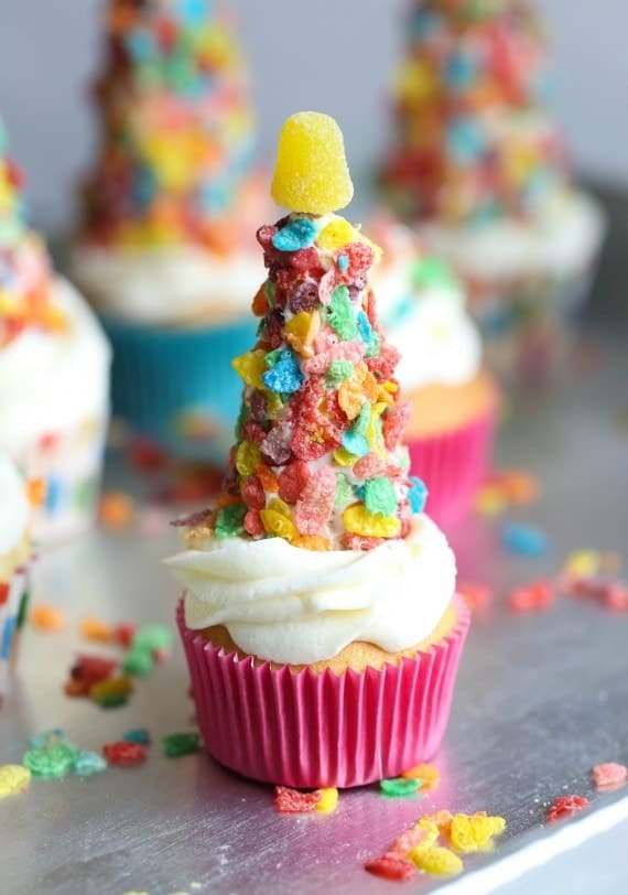 Cupcakes with fruity pebble party hats on top