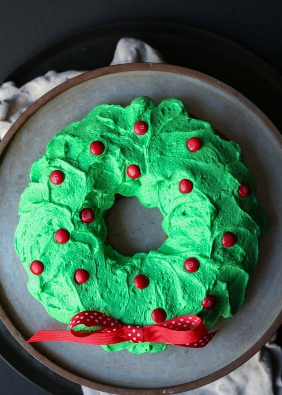 A Simple Bundt cale topped with green frosting and decorated with red M&M'S! Easy and delicious!