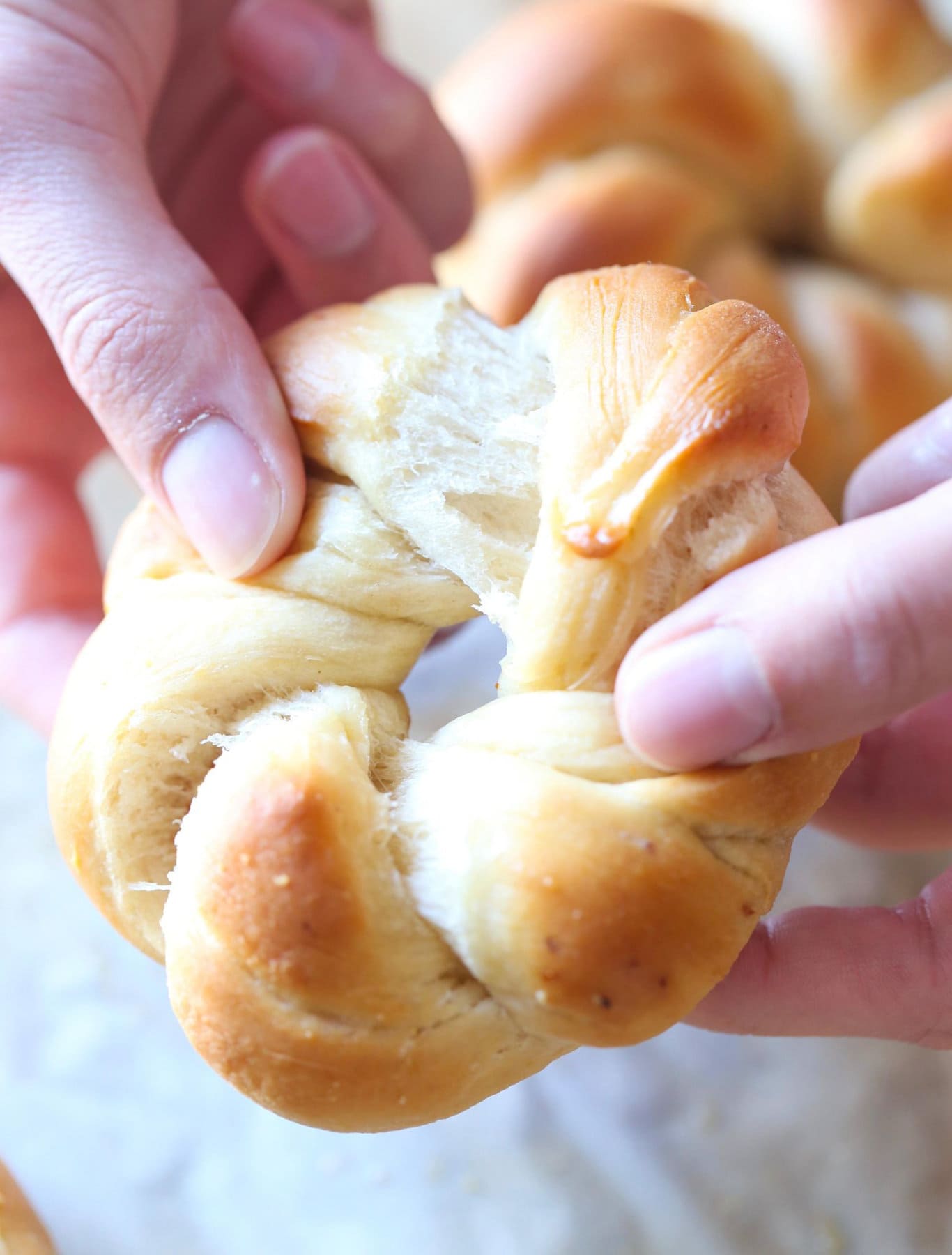 Garlic knot being pulled apart