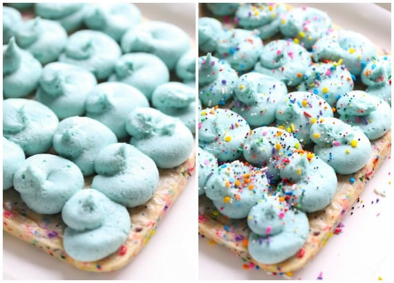 Unicorn Bars are buttery, sugar cookie bars loaded with rainbow sprinkles and topped with clouds of blue buttercream!