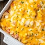 Overhead view of baked salsa verde chicken casserole in a ceramic casserole dish.