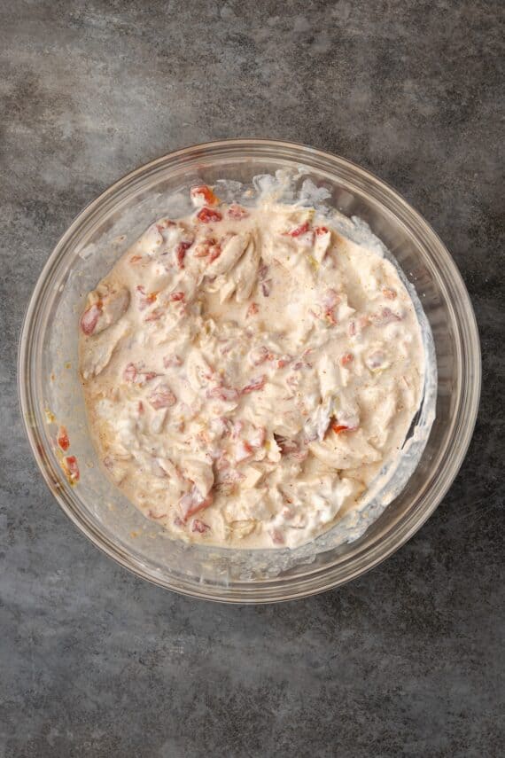 Chicken casserole filling in a glass bowl.
