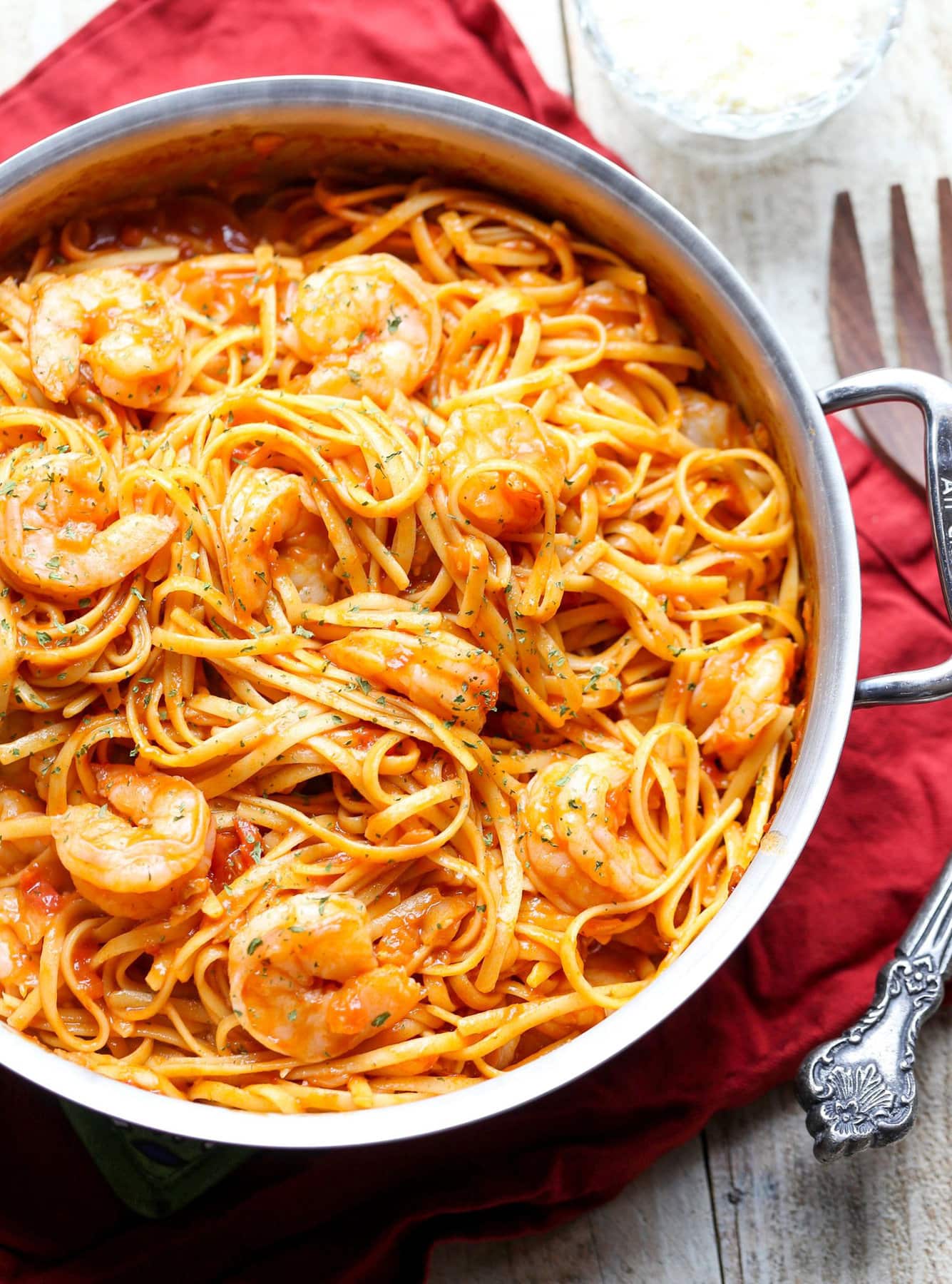 Overhead image of one-pot shrimp pasta in a skillet.