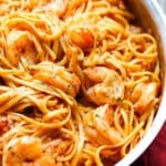 One-pot shrimp pasta in a skillet.