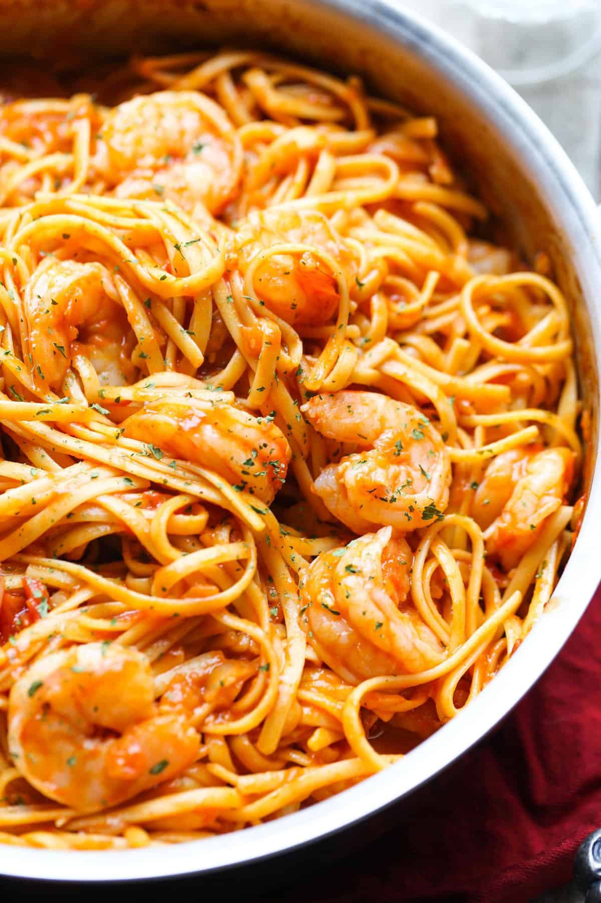 One-pot shrimp pasta in a skillet.