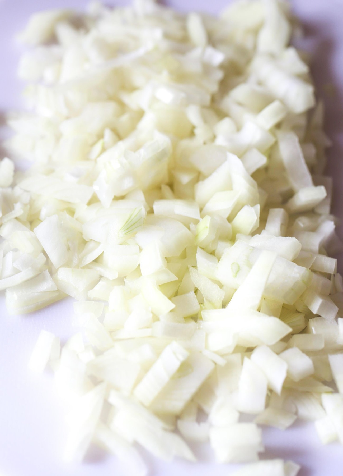 Diced onions on a cutting board