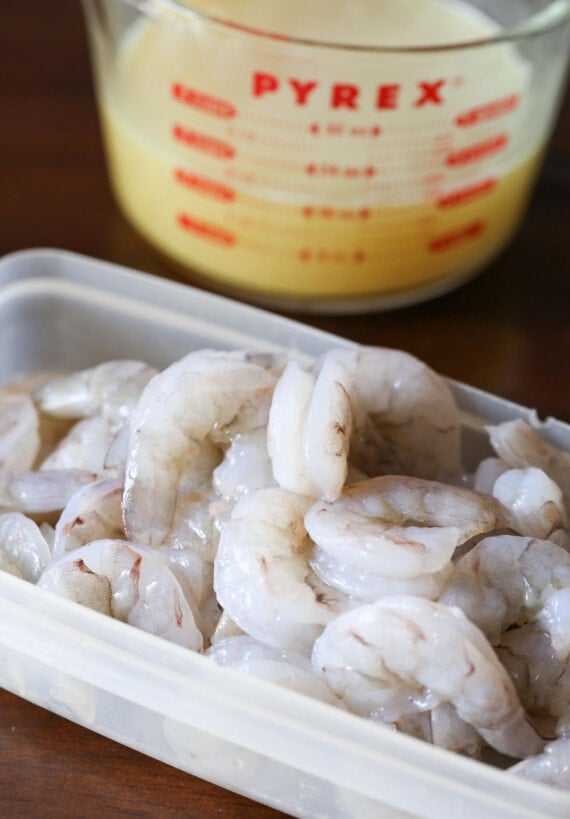 Peeled and deveined shrimp in a tub ready to add to one-pot shrimp pasta.