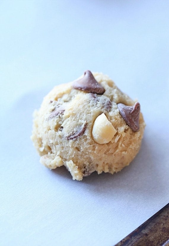 A ball of unbaked Sausalito cookie dough on a mat.