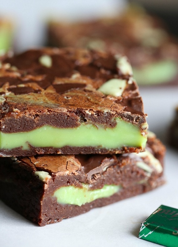 Two mint fudge stuffed brownies stacked on top of one another.