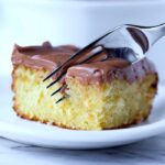 This is the easiest and softest sour cream cake ever. My family asks for it again and again and the chocolate frosting is easily the creamiest I ever had!