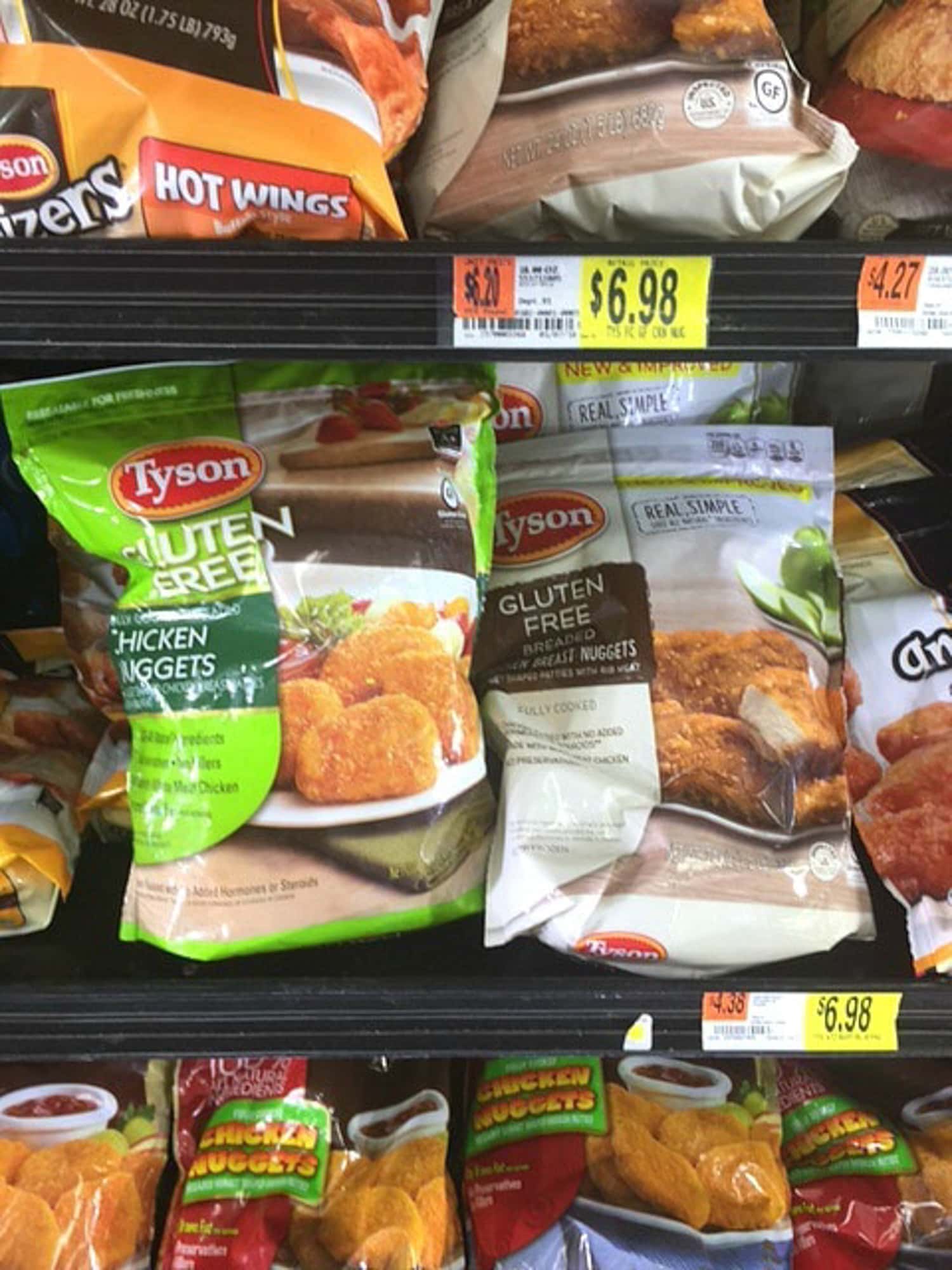 Packages of frozen chicken patties at the store in the freezer aisle