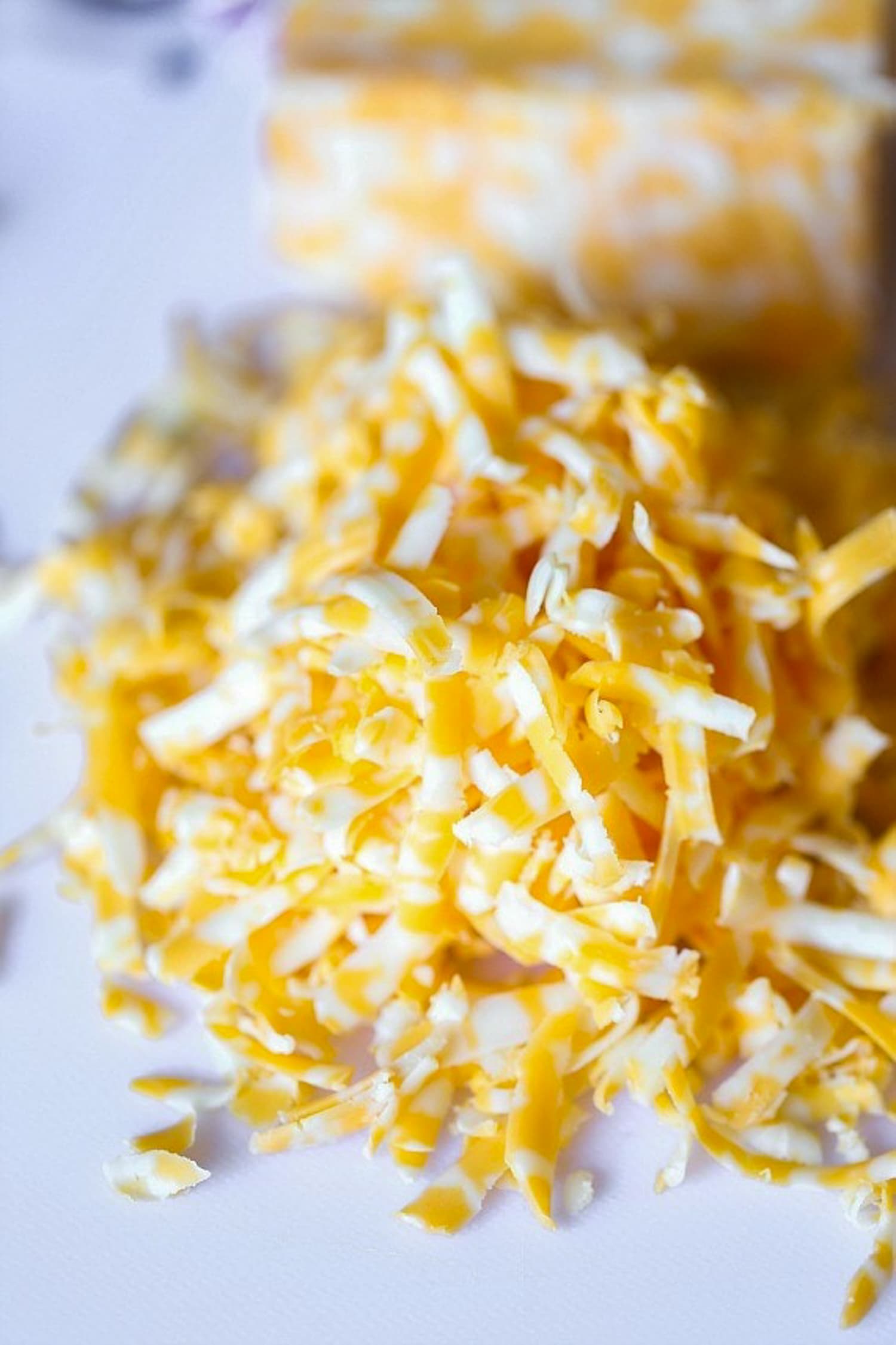 grated Colby jack cheese on a cutting board