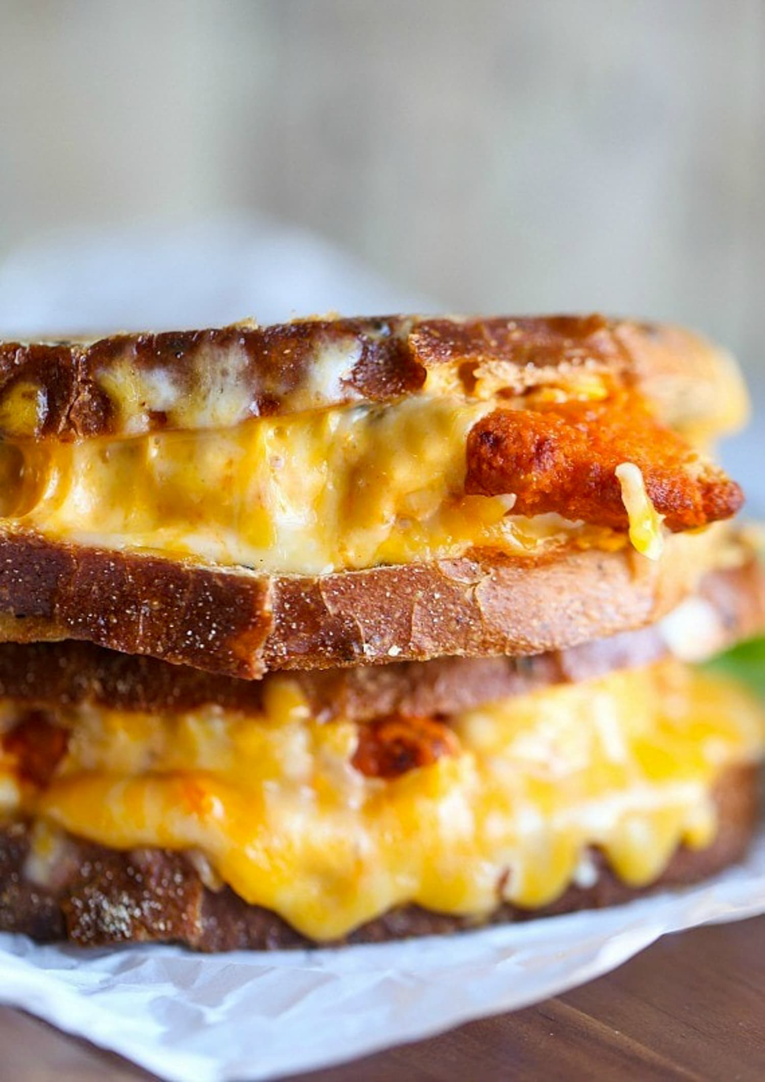 Two Buffalo Chicken Grilled Cheese sandwiches stacked on top of each other.