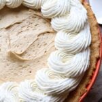 A Cookie Butter Pie Topped with Swirls of Homemade Whipped Cream