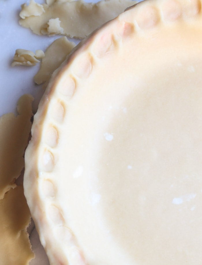 An Assembled Cream Cheese Pie Crust with Pinched Edges