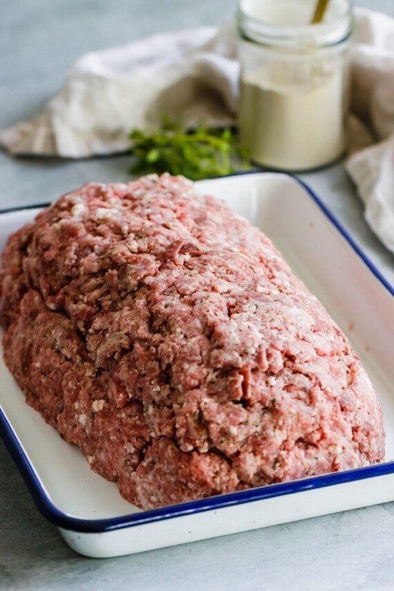 Unbaked meatloaf in a pan.