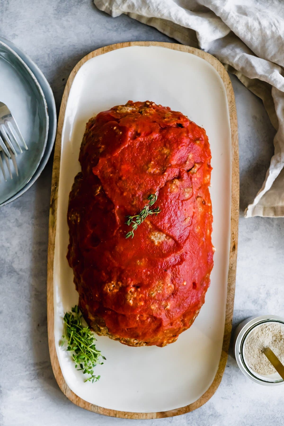 Pizza meatloaf on a cutting board.