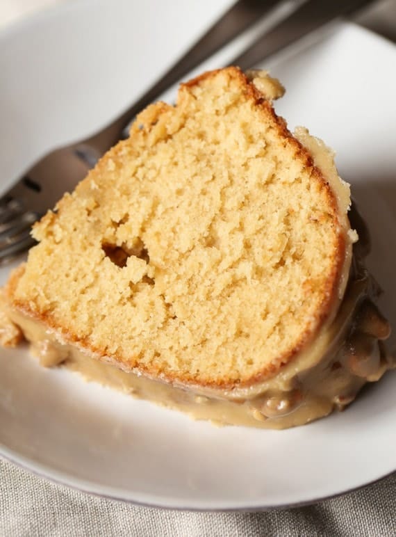 This Praline Bundt Cake is EVERYTHING! It's a soft brown sugar cake topped with ridiculous Praline icing.