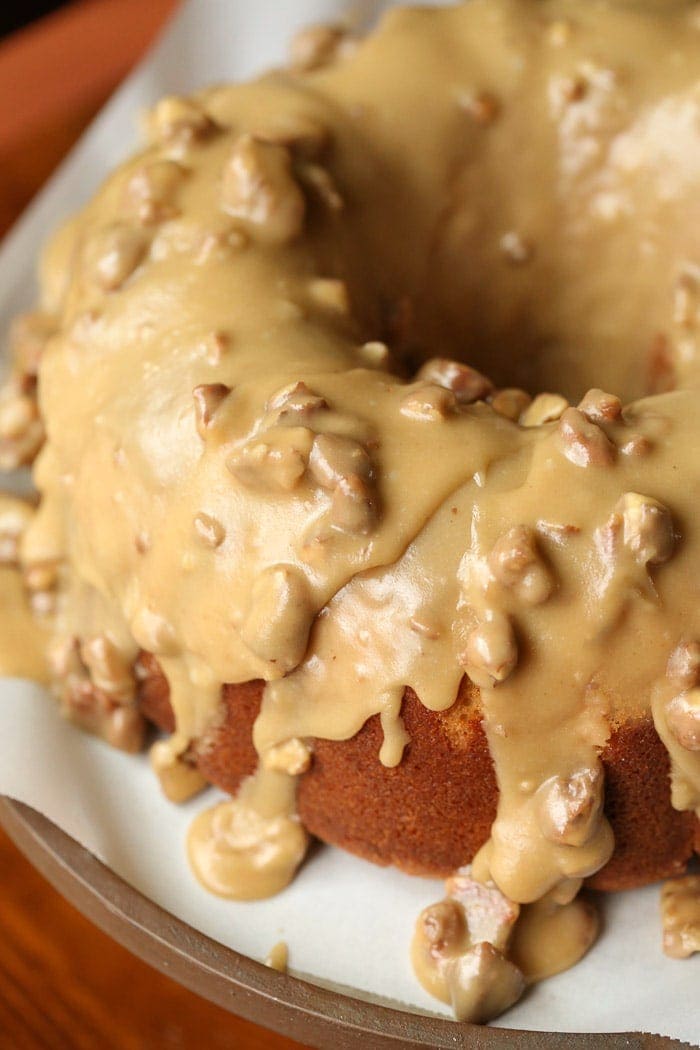 Praline Bundt Cake is a soft brown sugar bundt cake topped with pourable praline frosting. CRAZY delicious!
