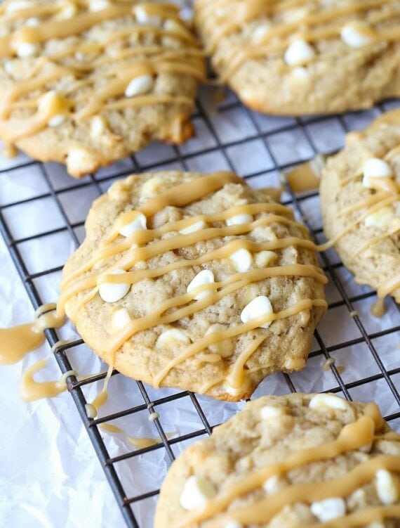 Bananas Foster Cookies... RIDICULOUSLY GOOD! Soft banana cookies, loaded with white chocolate and drizzled with Brown Sugar Rum sauce!