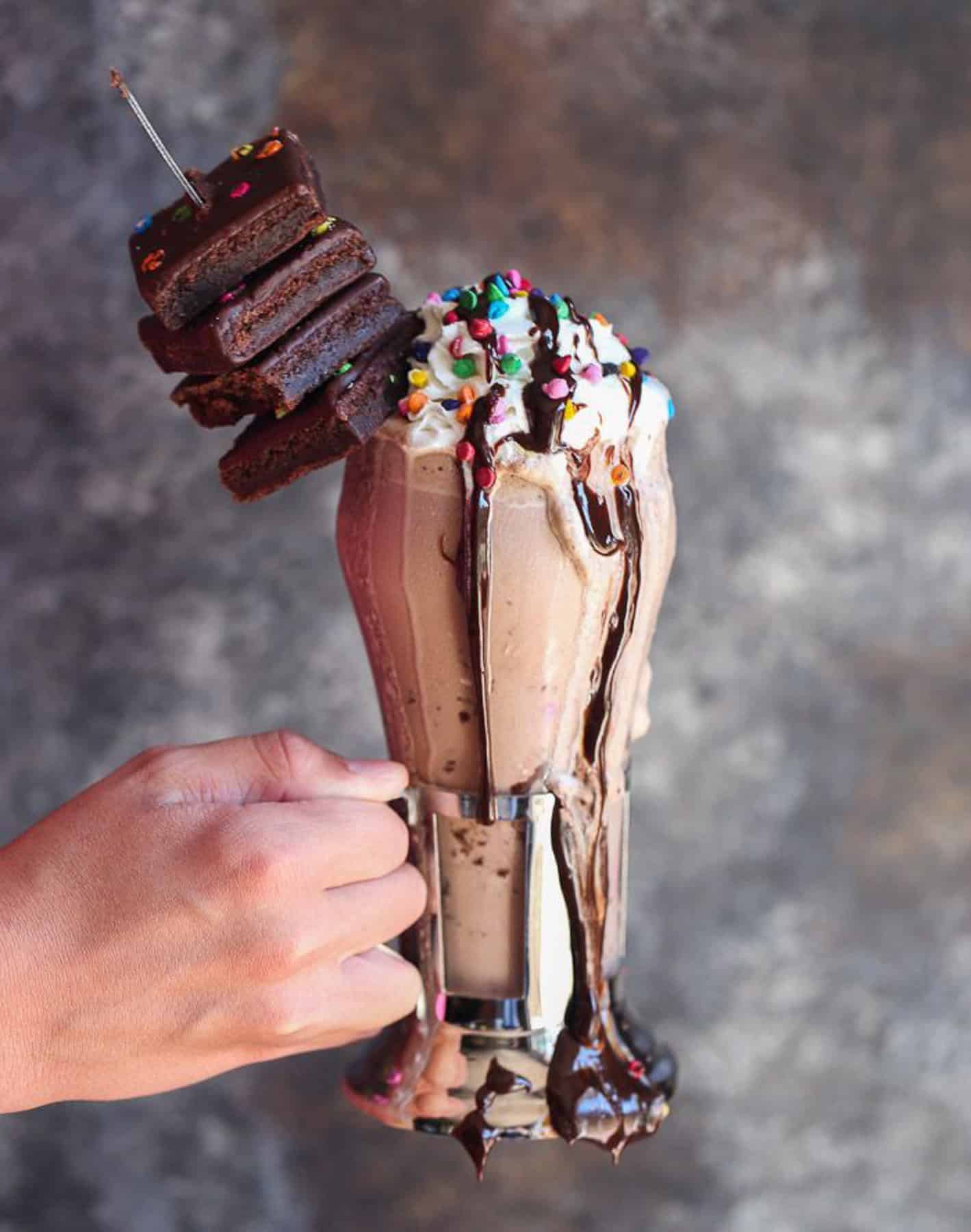 Holding the Rainbow Chip Brownie Milkshake 