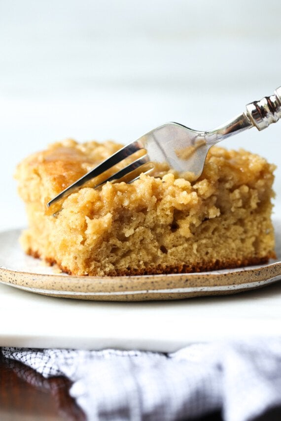 Brown Sugar Crumb Cake with a fork taking a bite