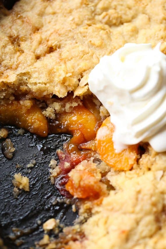 Skillet Sugar Cookie Peach Cobbler...a deliciously sweet peach cobbler topped with a sugar cookie and oat crumble!