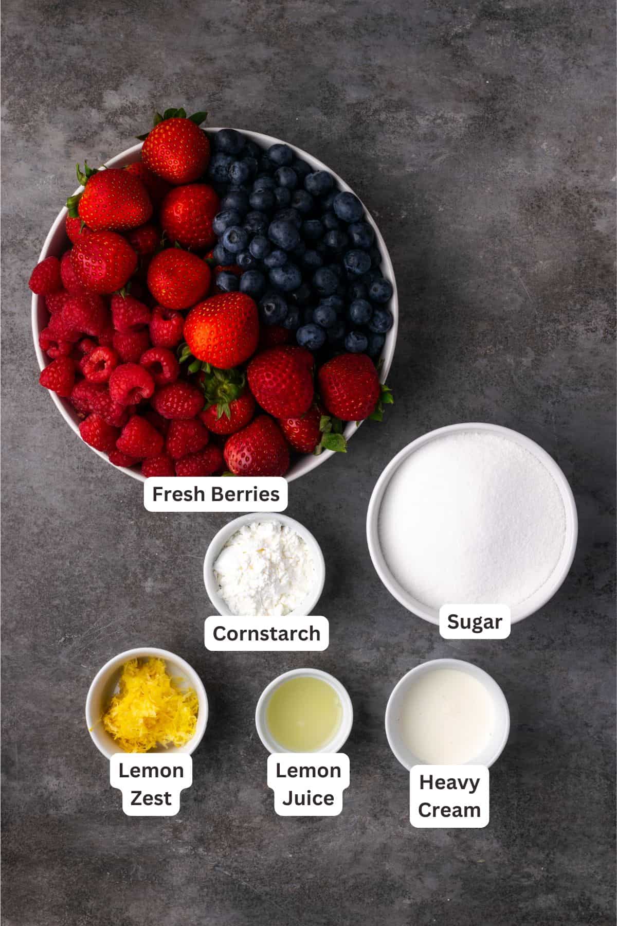 Berry slab pie ingredients with text labels overlaying each ingredient.