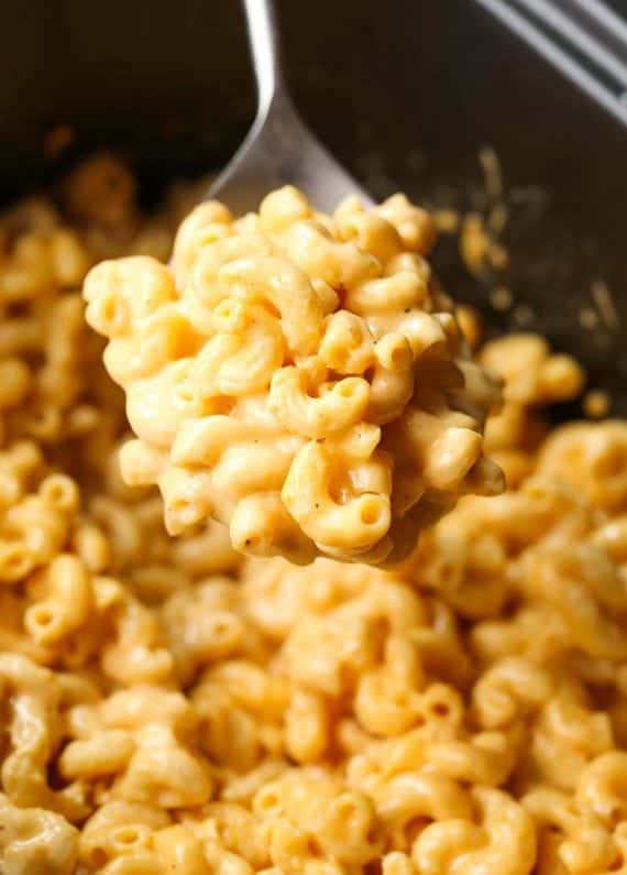 No need to boil your pasta before making this EASY Crock Pot Mac and Cheese! Super creamy and done in just a few hours!
