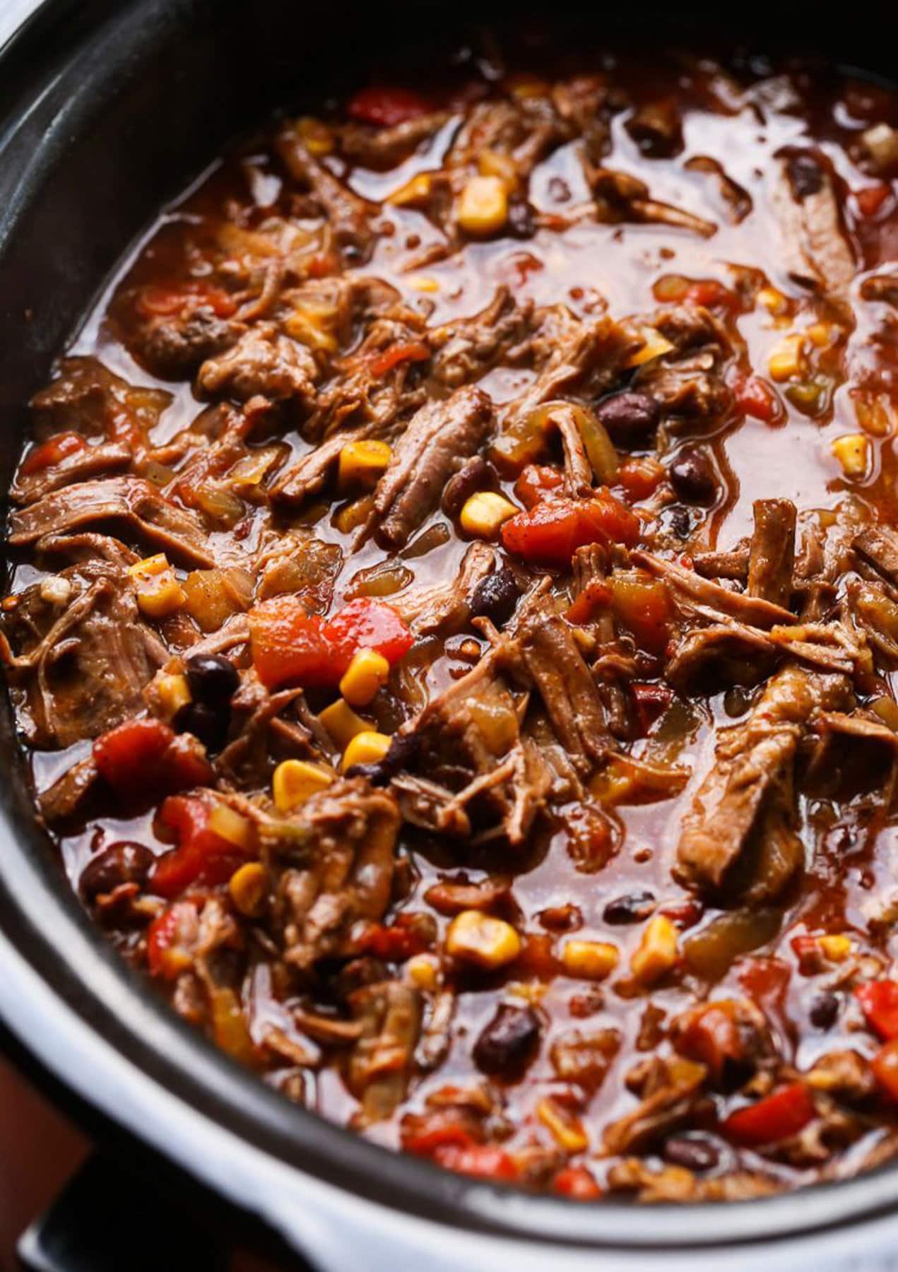 Taco truck chili in the bowl of a slow cooker.