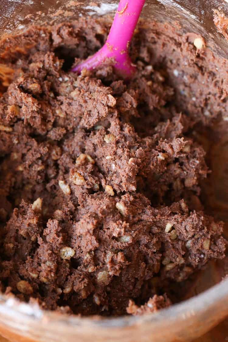 Cookie Dough Being Mixed in a Bowl with a Pink Spoon