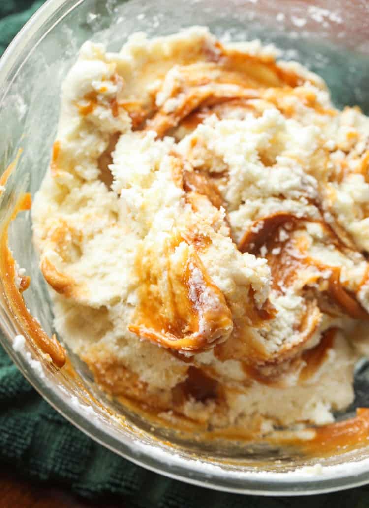 The ingredients for Dulce de Leche Swirled Vanilla Fudge are combined in a mixing bowl.