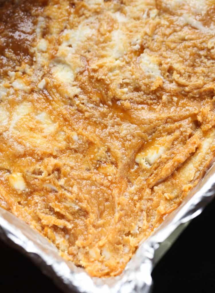Dulce de Leche Swirled Vanilla Fudge spread in a baking pan.