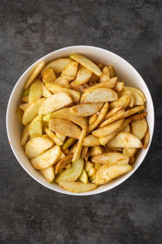 Sliced apples tossed in flour and cinnamon sugar.