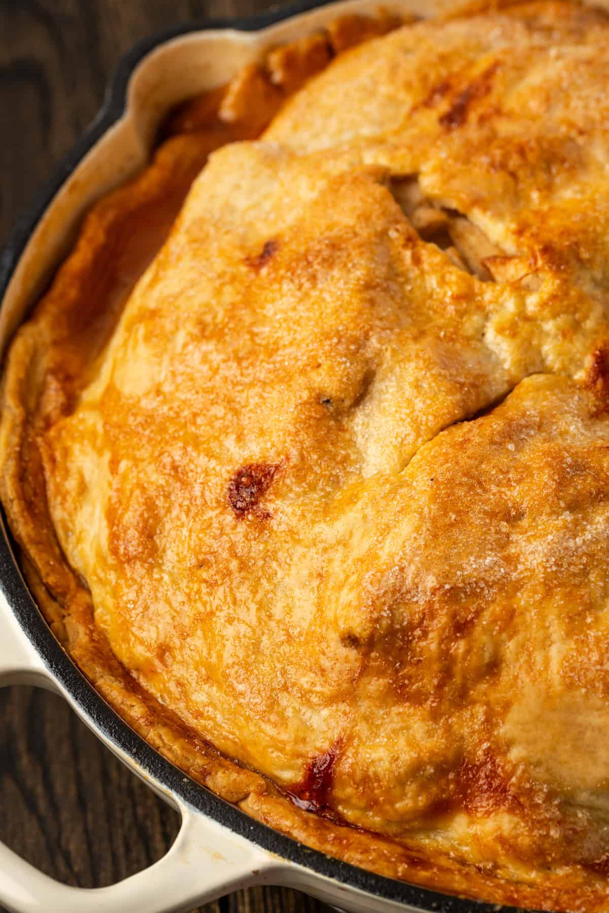 Close up of a freshly baked skillet apple pie.