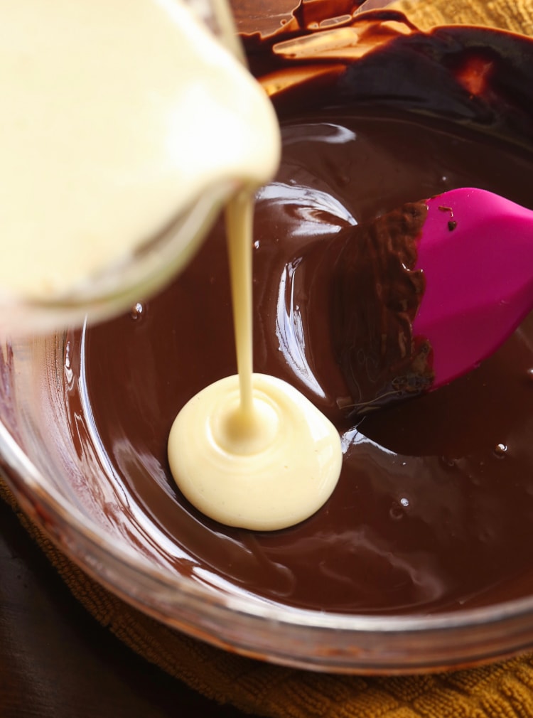 The Vanilla Mixture Being Poured Into the Bowl of Melted Chocolate and Butter