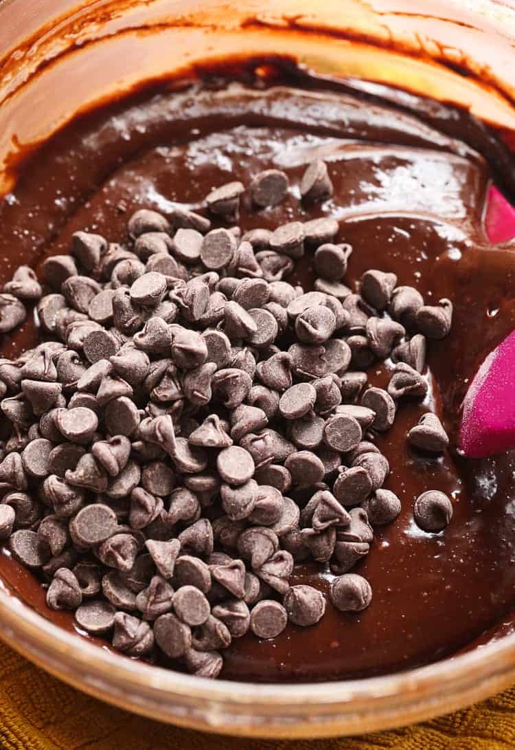 The Chocolate Cookie Batter in a Glass Bowl with Chocolate Chips Added In