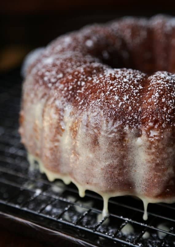 Glazed eggnog butter cake on a wire rack.