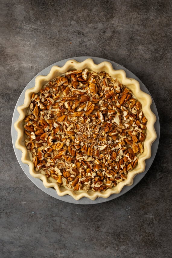 Assembled cheesecake pecan pie.