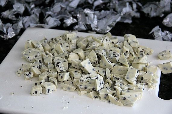 Chopped cookies 'n creme candy on a cutting board