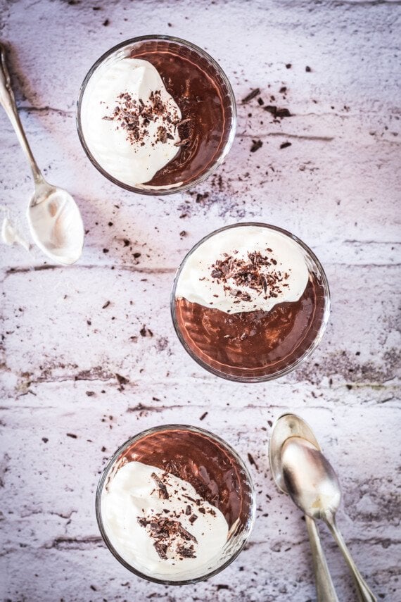Chocolate pudding topped with whipped cream.