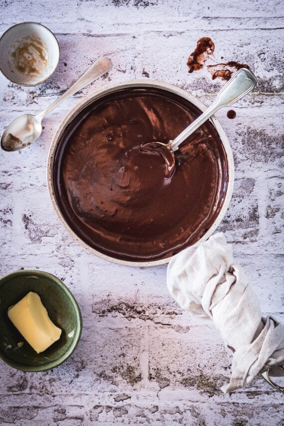 Sauce pan full of chocolate pudding.
