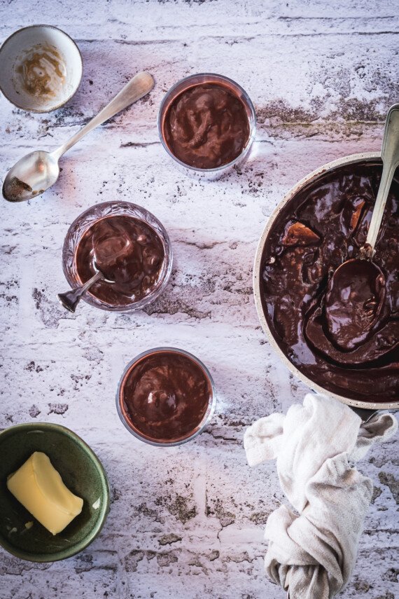 Chocolate pudding in three bowls.
