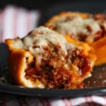 Pizza muffin showing off inside and melted cheese